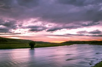 sunset montana river mountains fly fishing guided trip